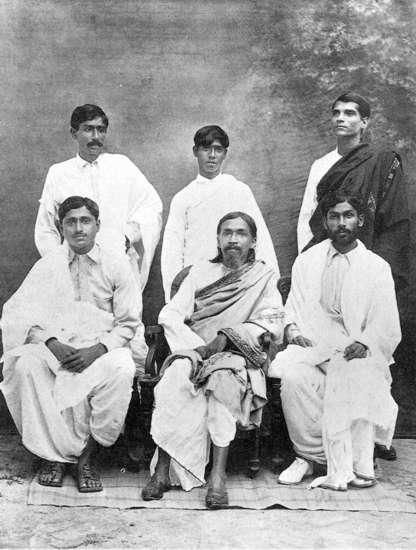 Nolini Kanta Gupta [seated extreme right] with Sri Aurobindo, Bijoy Nag [seated extreme left] and Su