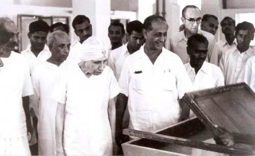 The Mother watching hand lifting of paper at the Handmade Paper Unit on 9 December 1959 with Nolini 