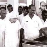 The-Mother-watching-hand-lifting-of-paper-at-the-Handmade-Paper-Unit-on-9-December-1959-with-Nolini-Kanta-Panu-Sarkar-K.-Amrita-Dayakar-Prabhakar-Udar-Pinto-Kiran-and-Pavitra.